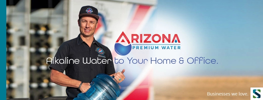 Man holding refillable drinking water container, Arizona Premium Drinking Water