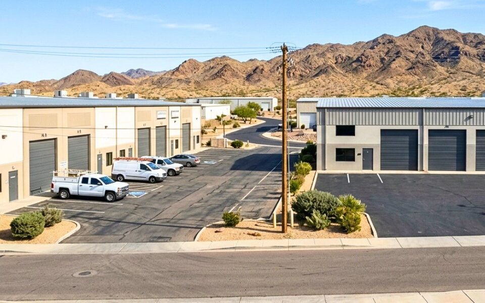 Occupied and vacant industrial buildings along a Lake Havasu commercial corridor